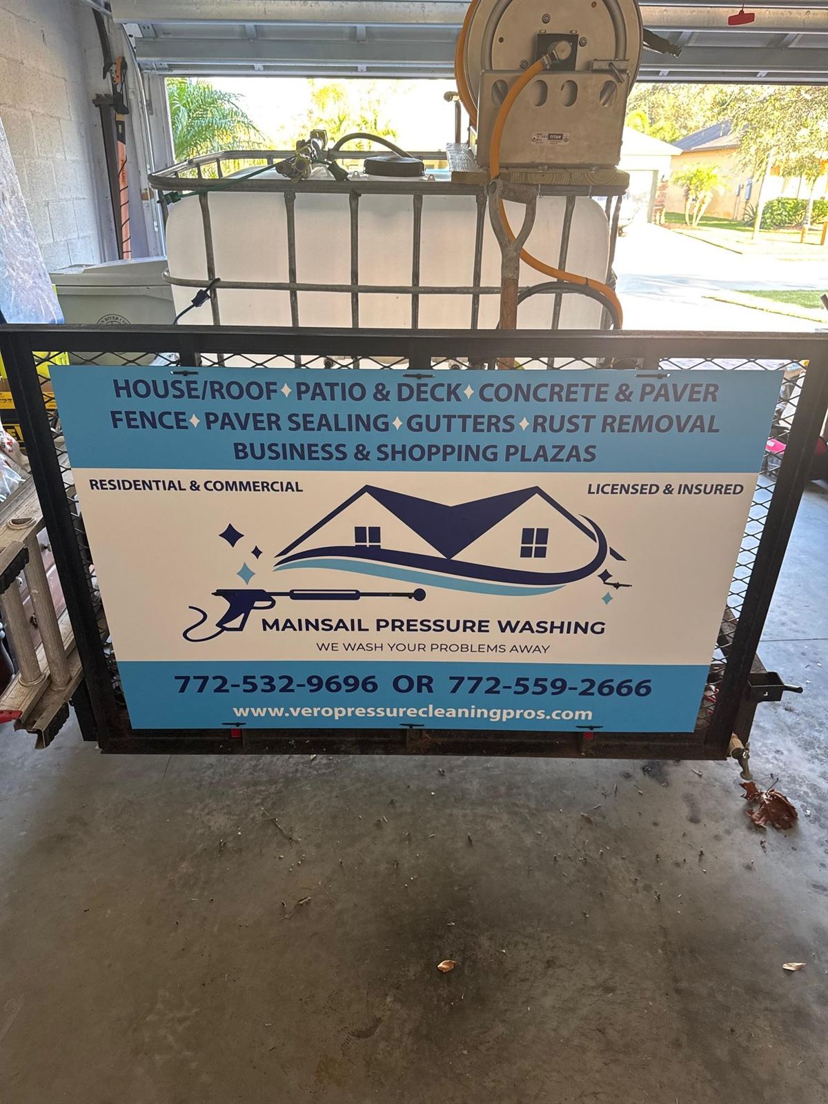 MainSail Pressure Washing crew cleaning a home exterior in Vero Beach, FL